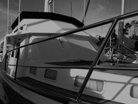 Boat window treatment, using white acrylic Sunbrella canvas.